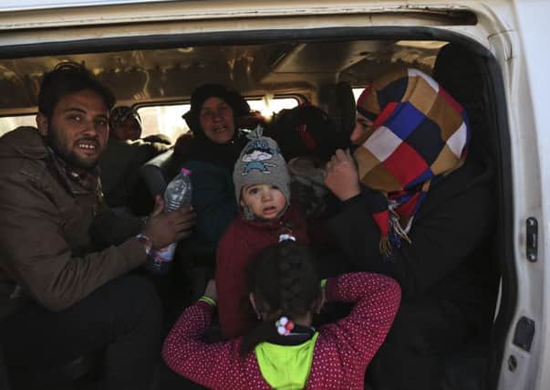 Refugees from Syria fleeing towards Turkey earlier this month after air strikes in their own country.