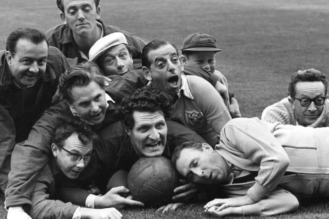 Stage and radio stars pictured during a training session for a football match at Bloomfield Road, Blackpool in aid of the Water Rats charities.
Front:- Eric Morecambe, Ernie Wise, Tommy Cooper and Charlie Chester.
Back:- Kenny Baker, Stan Stennett, Jimmy Jewel, Ben Warriss, Kerry Jewel (Jimmy's son)  and Jeeves.
Dated 22/08/1957
Published EG 26/08/1957