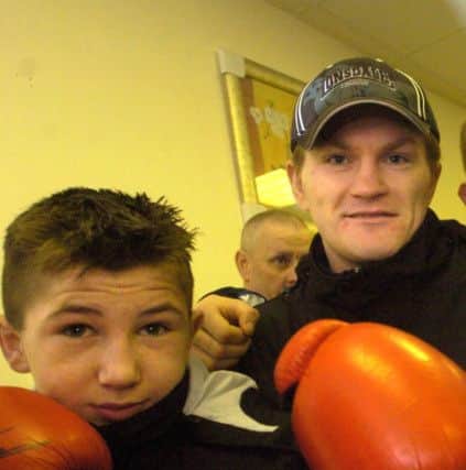 A young Isaac Lowe with Ricky Hatton during the Manchester great's visit to Lancaster back in 2009.