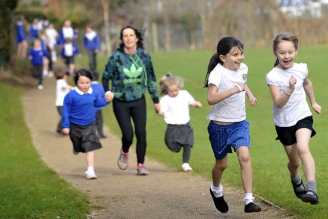 Pupils from Our Lady of Lourdes Primary take part in a one mile run for a keep fit health project organised by health professionals