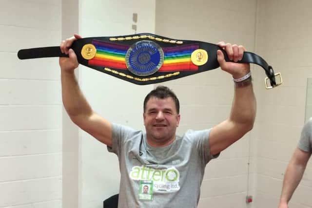 Bob Howard celebrates with the Commonwealth title.