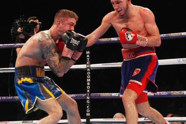 Isaac Lowe on his way to victory over Marco McCullough. Picture: Lawrence Lustig/Matchroom