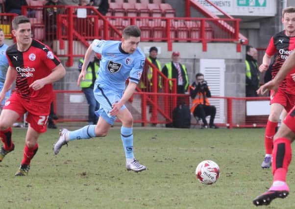 Shaun Miller looks for an opening against Crawley on Saturday.