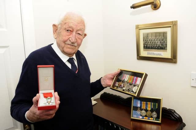 Veteran Reg Menzies with his Legion d'Honneur medal, his other war medals and his father's World War One medals.