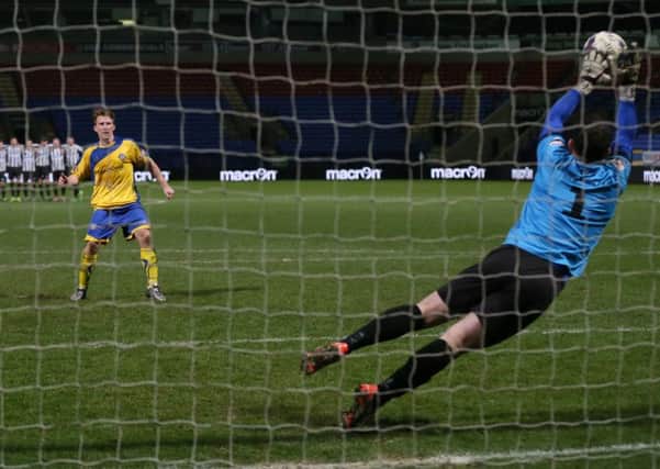 Lancaster City's Craig Carney has his penalty saved by Sam Ashton. Picture: Paul Currie