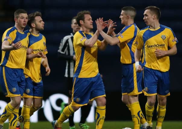 Neil Marshall, second from right, celebrates Lancaster City's opening goal on Monday night. Picture: Paul Currie
