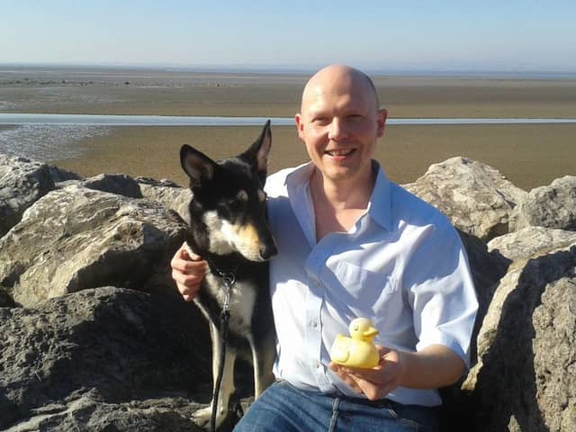 Nick Westell with Skye and the Irish rubber duck he found on Morecambe beach on St Patrick's Day.