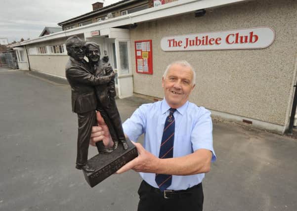Photo Neil Cross Jubilee Working Mens Club president Dave Miller with the plaque to mark the beginning of the Morecambe and Wise heritage trail, on the stage where Eric Morecambe had his first paid performance as a child