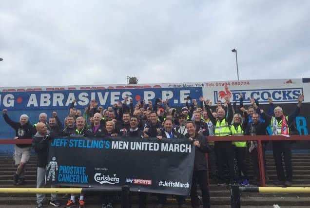 The Men United March team. John is pictured far right in the red scarf.