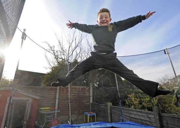 Oliver Smith, 8, one year after his last treatment for cancer