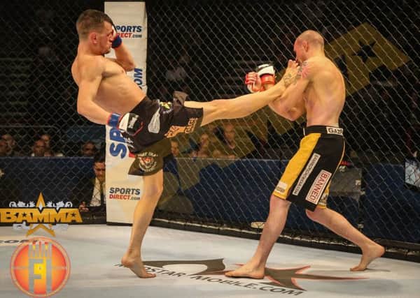 Shay Walsh in action against Gaz Pilot. Picture: BAMMA/Marc Moggridge