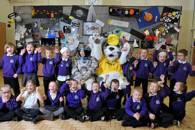 Photo Neil Cross
Teaching Assistant Carol Bonehill in the space suit at Morecambe Bay Primary School, with 'Sam the Dog', the Morecambe Midland Hotels lucky dog mascot, before blasting a smaller version of Sam into orbit.