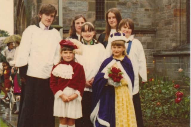 The six Patterson children with Linda at the back, and her mum Brenda outside St John's church in the 1970s.