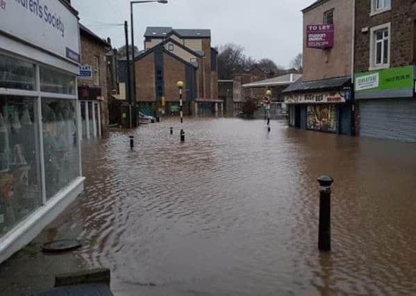 The scene outside the Lancaster Children's Society charity shop following the flooding.