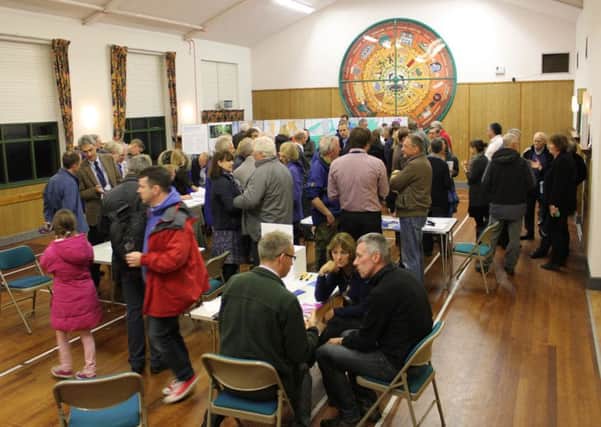 Residents at a drop-in event in Dolphinholme in 2015 having their say about future housing development in the village. Photo by Peter Adams.