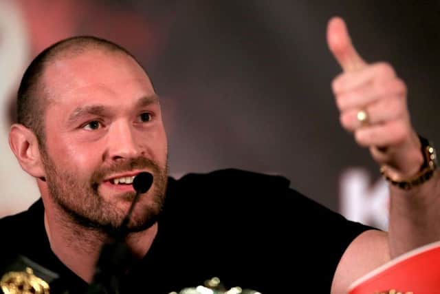 Tyson Fury gives the thumbs up during his press conference