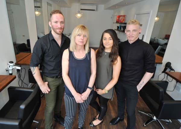 Photo Neil Cross
Tina Berry with Michael Gould, Emily King and Adam Emslie, in Heaton Hair, Chapel Street, Lancaster, which has reopened after the December floods