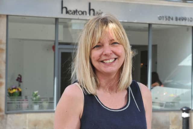 Photo Neil Cross
Tina Berry, owner of  Heaton Hair, Chapel Street, Lancaster, which has reopened after the December floods