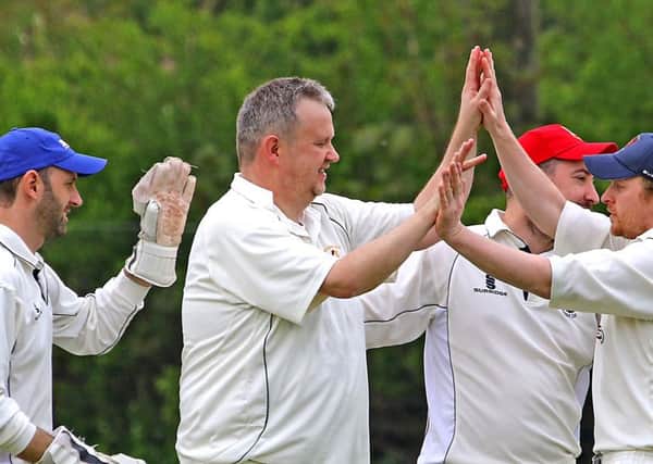 Torrisholme's Graham Lee celebrates his wicket. Picture: Tony North
