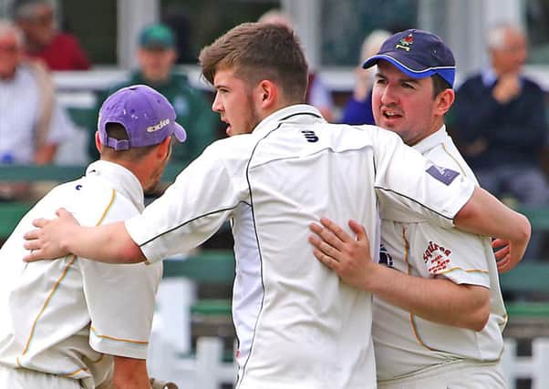 Callum East is congratulated on a wicket. Picture: Tony North