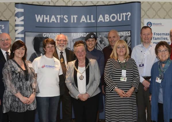 County Councillor Margaret Brindle (centre)  with some of the charity and Masonic representatives.