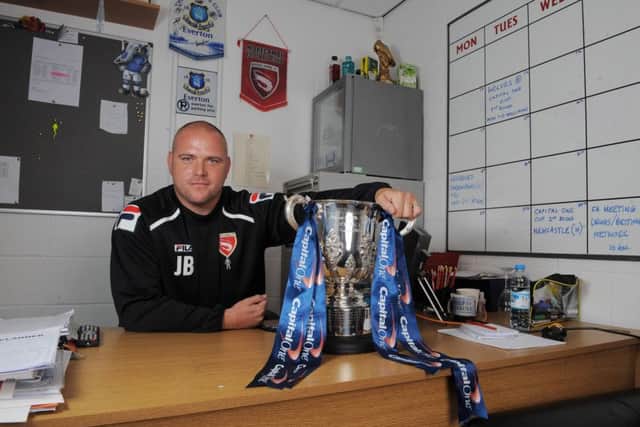 Jim Bentley poses with the Capital One Cup ahead of Morecambe's game against Newcastle. Picture: Paul Currie