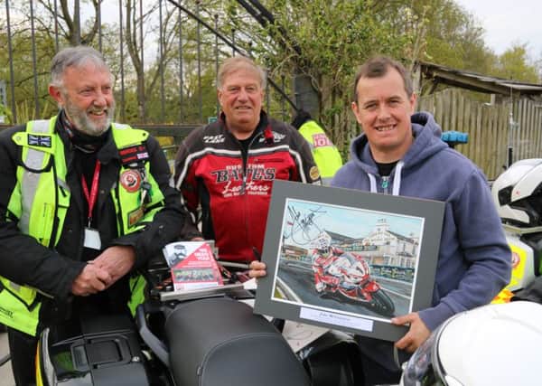 Paul Brooks Founder Member and Chairman of North West Blood Bikes Lancs and Lakes, Peter Foster Local Artist and Keen Biker, John McGuinness