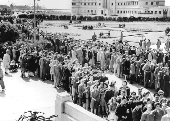Crowds waiting to get into the Super Swimming Stadium for a bathing beauty contest c 1945