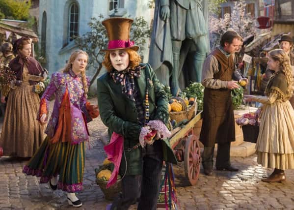 Alice (Mia Wasikowska) returns to the whimsical world of Underland to help the Hatter (Johnny Depp)