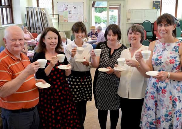 The Vincents team raises a cup to the Queen (from left) Mike Nichols, Lisa Lodge, Jennifer McPhee, Alison Kidd, Lesley Nichols and Claire Burns.