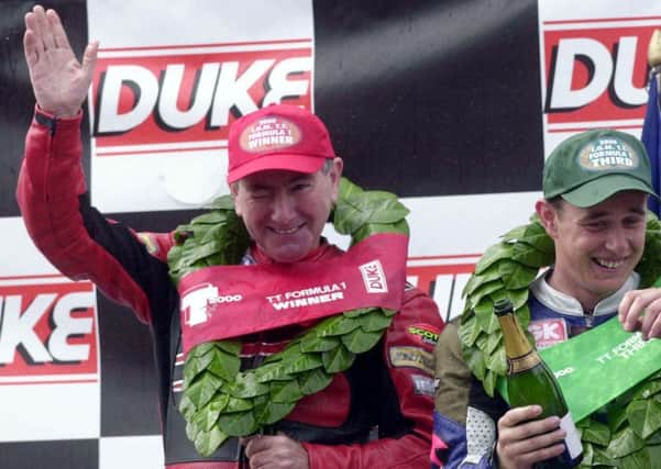 John McGuinness, right, on the podium with Joey Dunlop. Picture: Stephen Davison