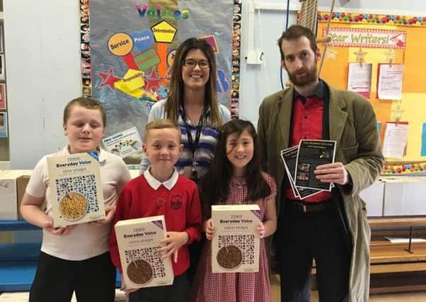 Robert Gillow landlord Mark Cutter with Year 3 pupils and teacher at Skerton St Luke's Primary School.