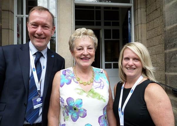Wendy (centre) with CancerCare CEO Neil Townsend and Volunteer Coordinator Andrea Partridge.