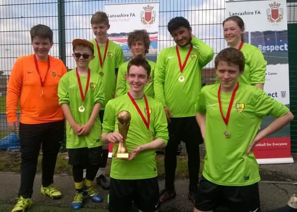 The North West Scorpions celebrate winning the U16 Ability Counts Cup at Lancashire FA headquarters in Leyland.