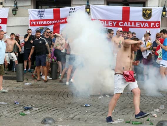 French police fire tear gas as they clashed with English football fans at The Queen Victoria pub in Marseille earlier this week (Pic: PA)
