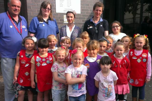The 1st Morecambe Rainbows with helpers Paul Good, Vicki Good, Melanie Monks and Chelsea Good, and leader Michele Good (back, second right).