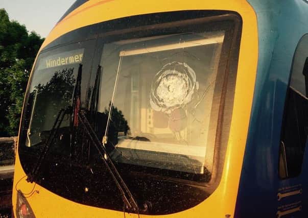 Stones were thrown at a train by yobs.