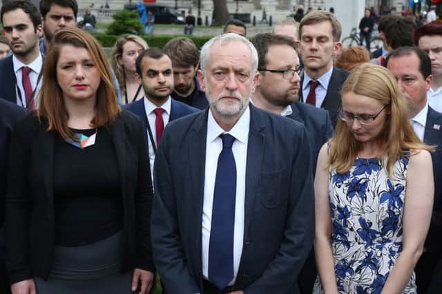 Labour Party leader Jeremy Corbyn  (centre) stands during an impromptu vigil at Parliament Square opposite the Palace of Westminster, central London, following the death of Labour MP Jo Cox, who died after being shot and stabbed in the street outside her constituency advice surgery in Birstall, West Yorkshire. PRESS ASSOCIATION Photo. Picture date: Thursday June 16, 2016. The alleged gunman has been named locally as Tommy Mair, 52, who neighbours in Birstall have described as "a loner". See PA story POLICE MP. Photo credit should read: Philip Toscano/PA Wire