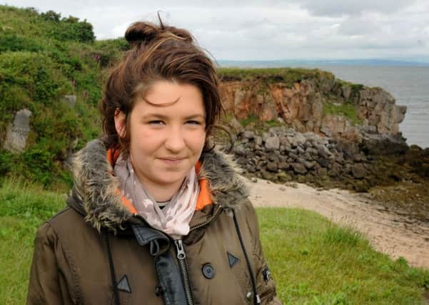 Megan Walton, 17, feels lucky to be alive after falling 15ft from the cliff at Heysham Point, Morecambe, pictured back at the scene.