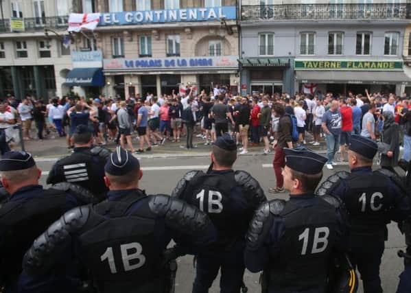 French police watch England fans in Lille, France. Photo: Niall Carson/PA Wire