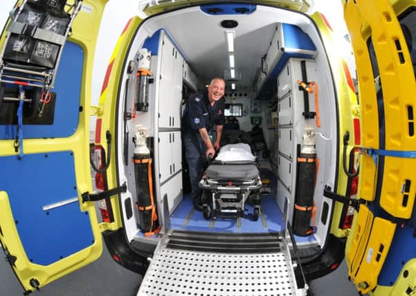 Gary Bartholomew of Trust Medical in one of its ambulances. Photo by Neil Cross.