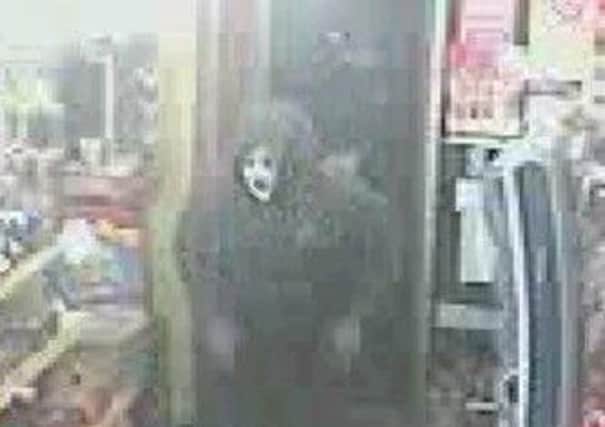 Armed robbers targeted shops in Morecambe and Lancaster wearing halloween masks.