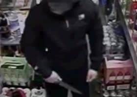 Armed robbers wearing halloween masks and carrying knives robbed two stores in Morecambe and Lancaster.