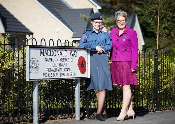 Barratt Quernmore Park in Lancaster. The new street has been named MacDonald Way after Lieutenant Ronald MacDonald. Pictured are  Eleanor Mason, a 14-year-old air cadet, and her mother Helen.