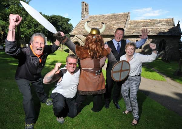 Photo Neil Cross
David Wilcock and Pete Whaley of Heysham Neighbourhood Council and Councillor David and Carla Brayshaw with Horace of Heysham preparing for the Viking Festival