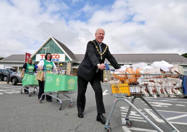 Photo Neil Cross
Carnforth Tesco - Food bank
Mayor, Coun Roly Parker with Carla Barton and Rebecca Kitchen