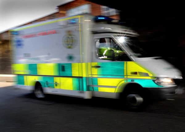 A woman was rushed to hospital with major trauma after falling from a window.
