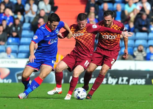 Rhys Turner, left, in action for Oldham.
