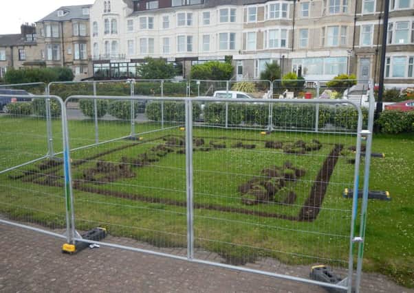 The new location for the Morecambe mosaic on Marine Road is fenced off ready for it to be installed.
