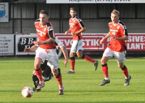 Michael Rose, left, and Ryan Croasdale, right, in action against Bamber Bridge.